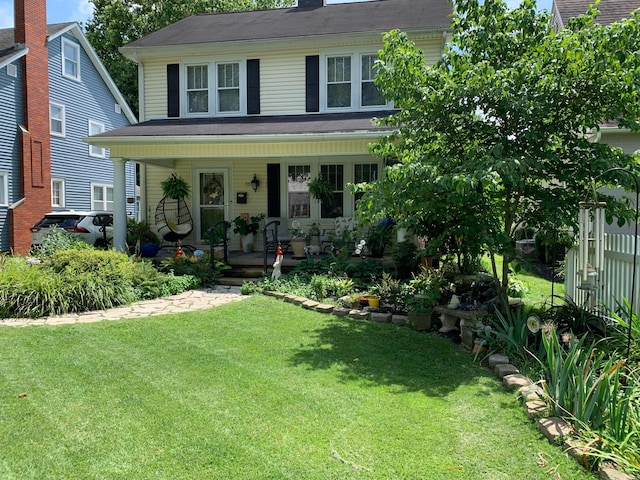550 E Allen St, Lancaster, OH 43130 - traditional style home with a porch, a front lawn, and a chimney