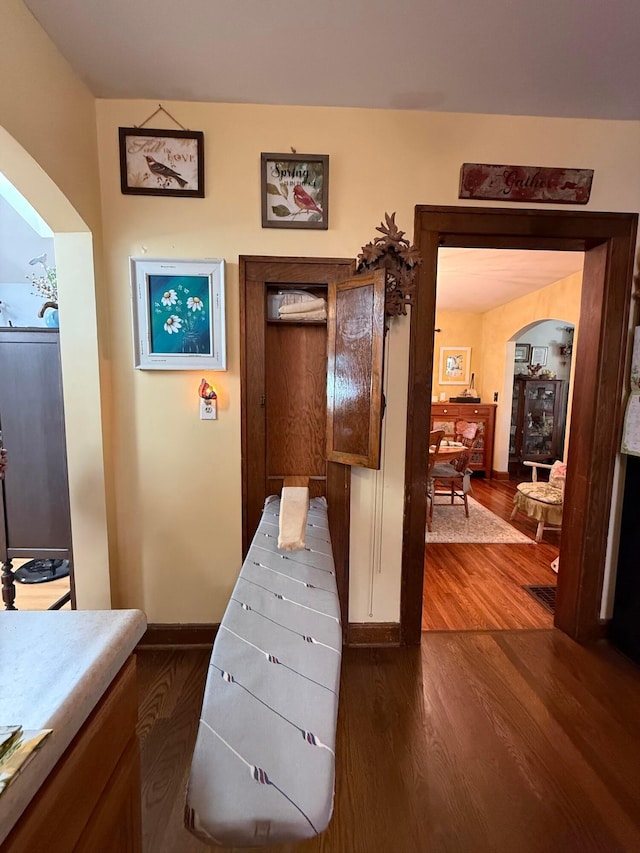 550 E Allen St, Lancaster, OH 43130 - corridor with arched walkways and dark wood finished floors