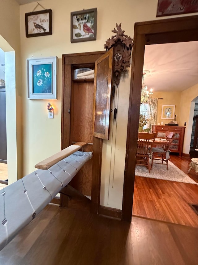 550 E Allen St, Lancaster, OH 43130 - corridor with dark wood-style floors and a chandelier