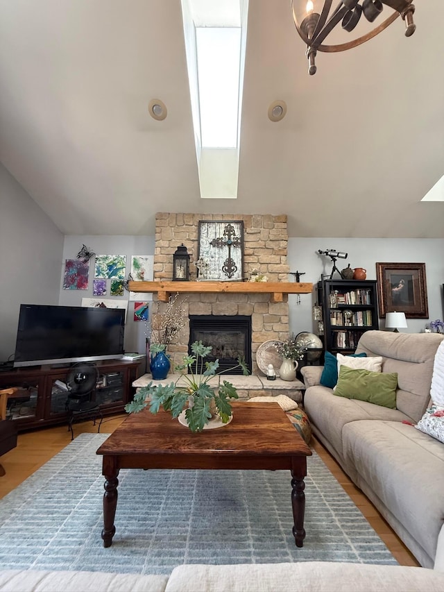 550 E Allen St, Lancaster, OH 43130 - living room featuring a fireplace, lofted ceiling, a skylight, and wood finished floors