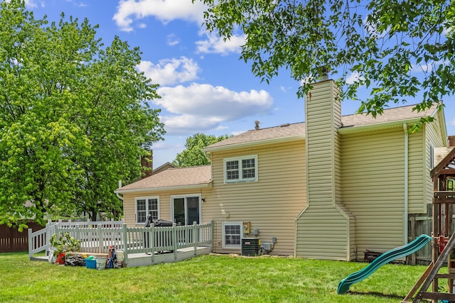 5690 Brinkley Ct, Columbus, OH 43235 - back of house with a playground, a chimney, a deck, and a shingled roof