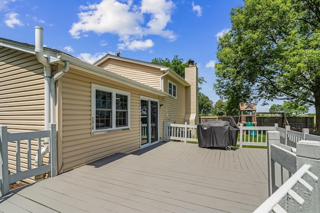 5690 Brinkley Ct, Columbus, OH 43235 - wooden terrace with a playground, a fenced backyard, and a grill