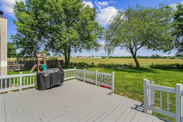 5690 Brinkley Ct, Columbus, OH 43235 - wooden deck with area for grilling, a playground, and a view of countryside