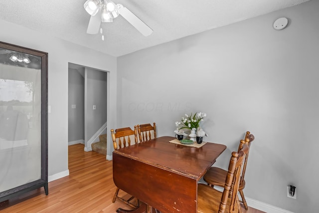 5690 Brinkley Ct, Columbus, OH 43235 - dining room with ceiling fan, light wood-type flooring, and stairs