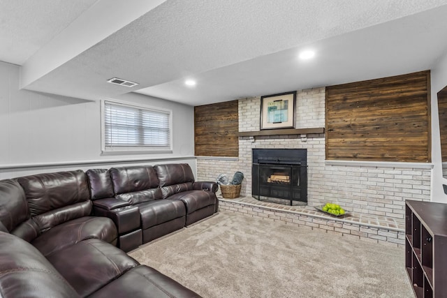 5690 Brinkley Ct, Columbus, OH 43235 - carpeted living room featuring a textured ceiling, a brick fireplace, wood walls, and recessed lighting