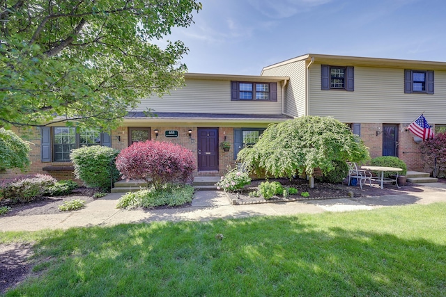 655 Providence Ave Unit 9-655J, Columbus, OH 43214 - view of front of property featuring brick siding and a front lawn