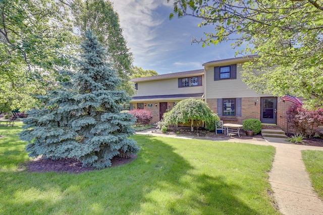 655 Providence Ave Unit 9-655J, Columbus, OH 43214 - view of front facade with brick siding and a front yard