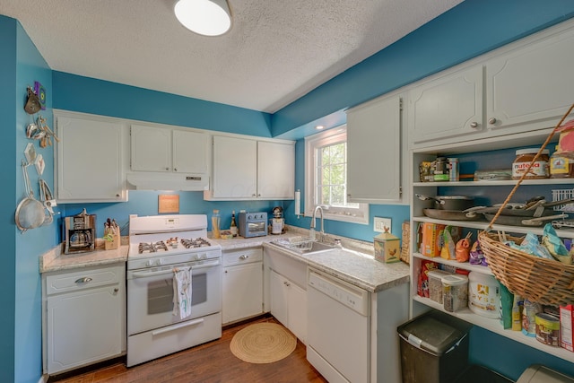 655 Providence Ave Unit 9-655J, Columbus, OH 43214 - kitchen with white appliances, a sink, a textured ceiling, white cabinetry, and wood finished floors