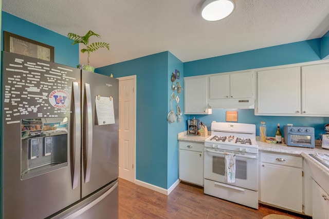 655 Providence Ave Unit 9-655J, Columbus, OH 43214 - kitchen with stainless steel fridge with ice dispenser, white range with gas cooktop, wood finished floors, under cabinet range hood, and white cabinets