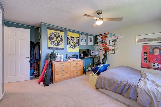 655 Providence Ave Unit 9-655J, Columbus, OH 43214 - carpeted bedroom with a textured ceiling, a desk, and ceiling fan