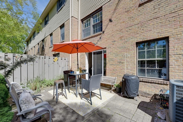655 Providence Ave Unit 9-655J, Columbus, OH 43214 - view of patio / terrace with outdoor dining space, grilling area, and central AC
