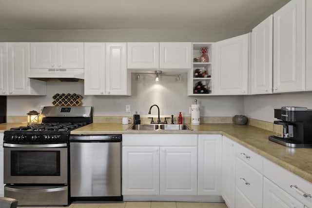 1015 Westview Dr, Hebron, OH 43025 - kitchen with dishwasher, stainless steel range with gas cooktop, under cabinet range hood, and white cabinets