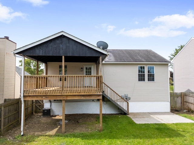 1047 Cherry Bud Dr, Columbus, OH 43228 - back of house with roof with shingles, a wooden deck, central AC unit, and a patio