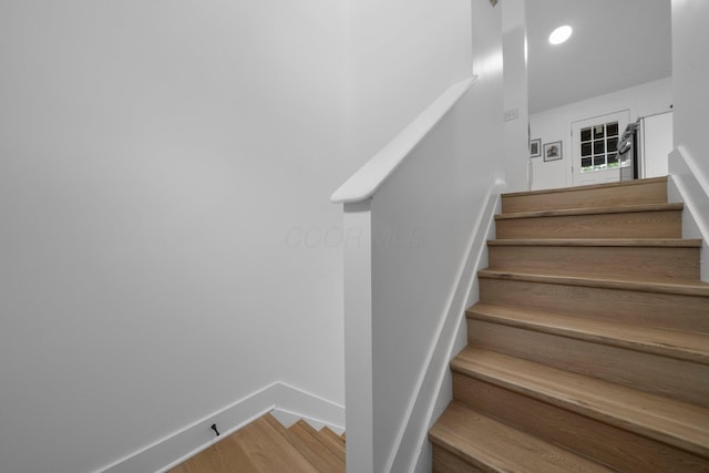1047 Cherry Bud Dr, Columbus, OH 43228 - stairway with wood finished floors and baseboards