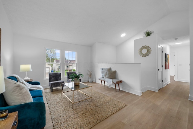 1047 Cherry Bud Dr, Columbus, OH 43228 - living area featuring vaulted ceiling, wood finished floors, baseboards, and recessed lighting