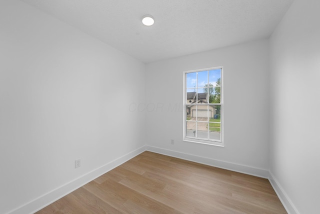 1047 Cherry Bud Dr, Columbus, OH 43228 - spare room featuring baseboards and light wood-type flooring