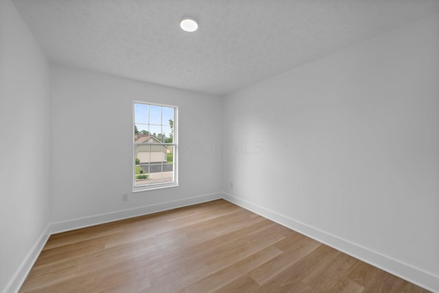1047 Cherry Bud Dr, Columbus, OH 43228 - empty room with baseboards and light wood-style floors