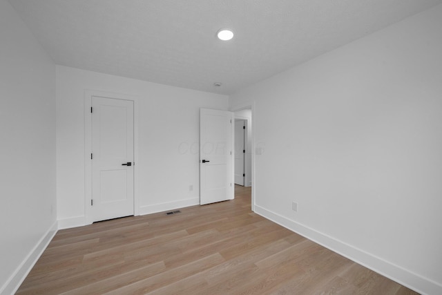1047 Cherry Bud Dr, Columbus, OH 43228 - unfurnished bedroom featuring baseboards and light wood-style floors