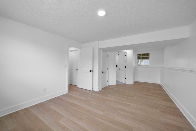1047 Cherry Bud Dr, Columbus, OH 43228 - unfurnished bedroom featuring a textured ceiling, baseboards, light wood-style floors, and recessed lighting