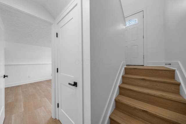 1047 Cherry Bud Dr, Columbus, OH 43228 - stairway featuring wood finished floors and baseboards