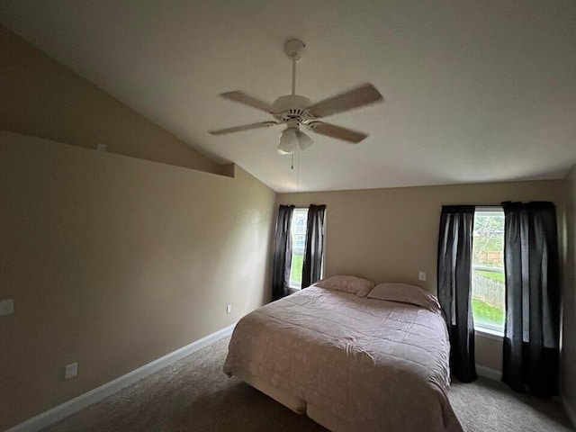 5321 Longshadow Dr, Westerville, OH 43081 - carpeted bedroom with multiple windows, lofted ceiling, baseboards, and a ceiling fan