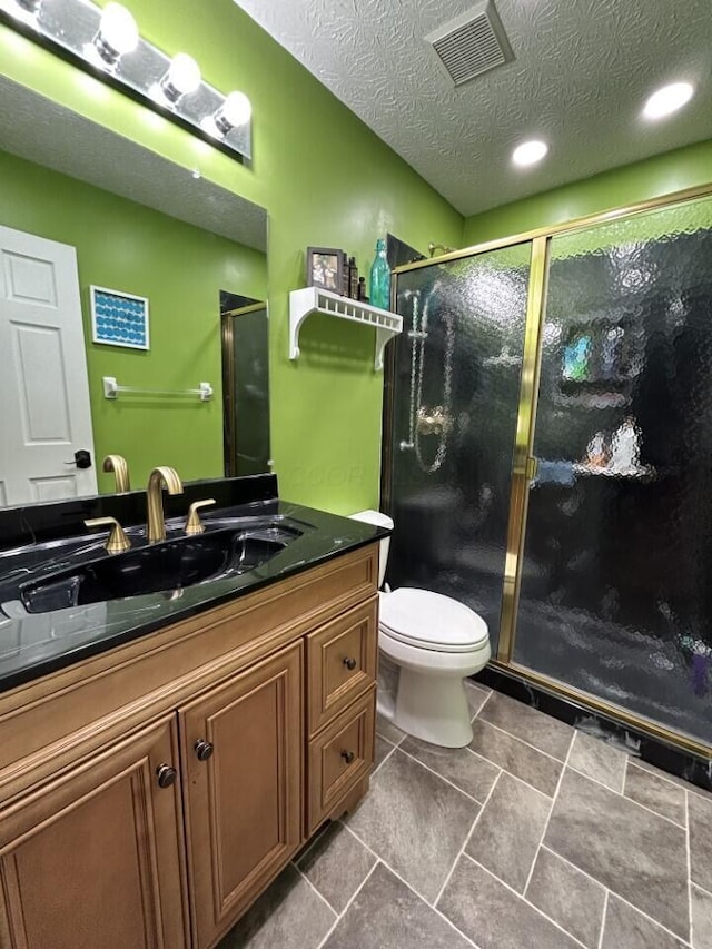 5321 Longshadow Dr, Westerville, OH 43081 - bathroom with vanity, a shower stall, toilet, and a textured ceiling