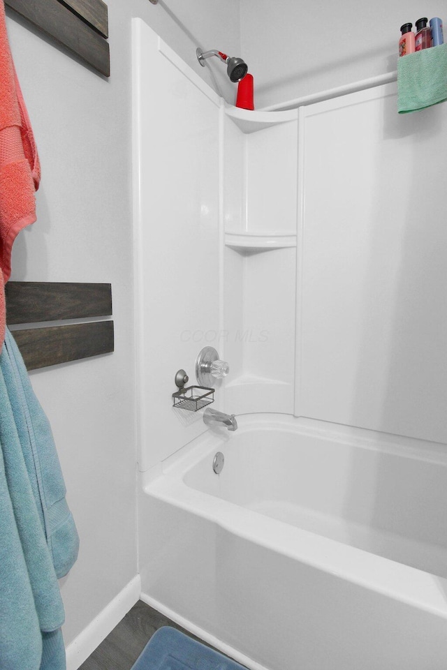 4037 Millview Ct, Columbus, OH 43207 - bathroom featuring baseboards and tub / shower combination