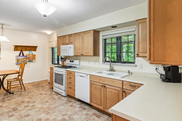 2049 Brandy Mill Ln, Dayton, OH 45459 - kitchen with white appliances, a sink, and light countertops
