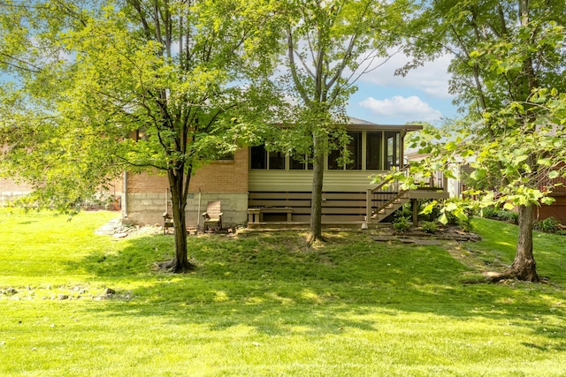 2049 Brandy Mill Ln, Dayton, OH 45459 - view of green lawn with a sunroom and stairs