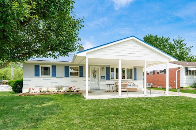52 Amsterdam Ave, Columbus, OH 43207 - view of front facade with a front lawn, a porch, brick siding, and a chimney