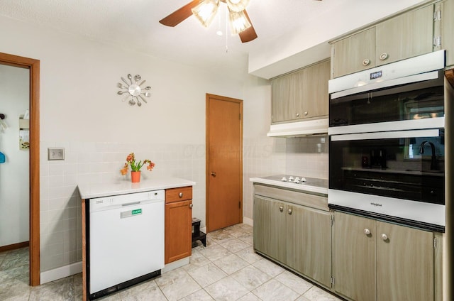 52 Amsterdam Ave, Columbus, OH 43207 - kitchen with dishwasher, tile walls, double oven, ceiling fan, and light countertops