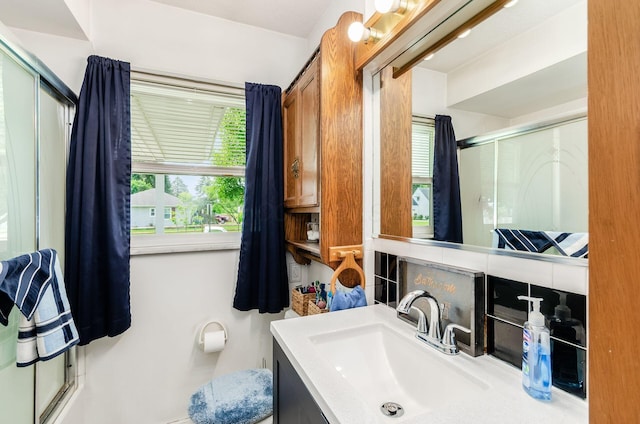 52 Amsterdam Ave, Columbus, OH 43207 - bathroom with a shower with shower door, vanity, and toilet
