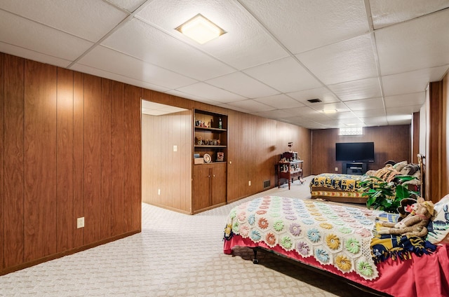 52 Amsterdam Ave, Columbus, OH 43207 - bedroom with wooden walls, carpet flooring, a drop ceiling, and baseboards