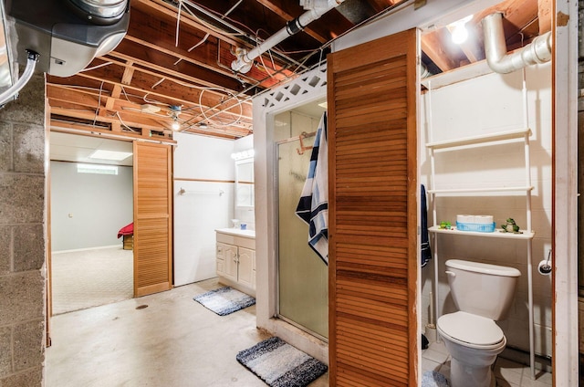 52 Amsterdam Ave, Columbus, OH 43207 - full bathroom with vanity, toilet, a shower stall, and concrete floors