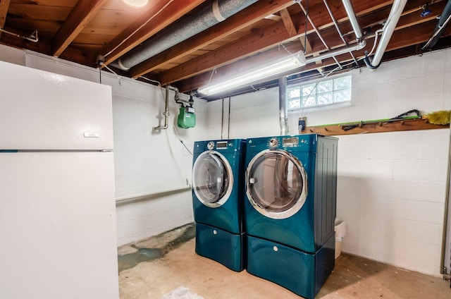 52 Amsterdam Ave, Columbus, OH 43207 - laundry area featuring washer and clothes dryer and concrete block wall