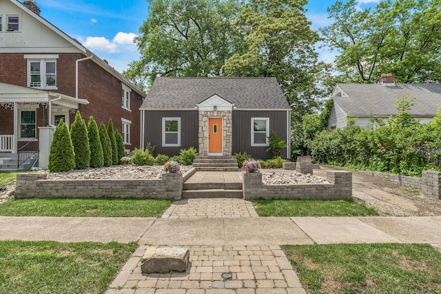 341 Woodland Ave, Columbus, OH 43203 - view of front facade featuring roof with shingles and an outbuilding