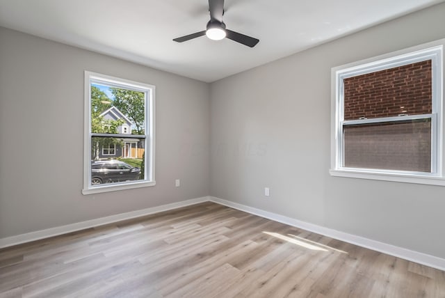 341 Woodland Ave, Columbus, OH 43203 - empty room with light wood-style flooring, baseboards, and a ceiling fan