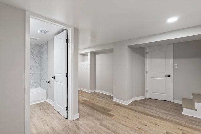 341 Woodland Ave, Columbus, OH 43203 - finished below grade area with light wood-type flooring, baseboards, and recessed lighting