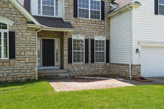 3899 Hampshire Ave, Powell, OH 43065 - property entrance with stone siding, roof with shingles, and a garage