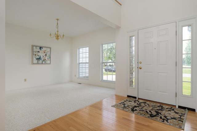 3899 Hampshire Ave, Powell, OH 43065 - entrance foyer featuring a chandelier, light wood-style flooring, and baseboards