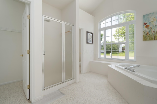 3899 Hampshire Ave, Powell, OH 43065 - bathroom with a shower stall, a bath, carpet floors, and lofted ceiling