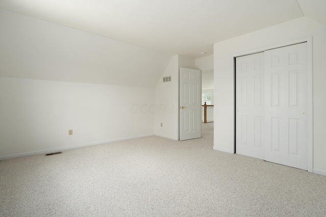 3899 Hampshire Ave, Powell, OH 43065 - additional living space featuring lofted ceiling, carpet floors, and baseboards