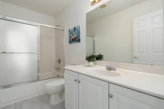 3899 Hampshire Ave, Powell, OH 43065 - bathroom featuring vanity, toilet, and combined bath / shower with glass door