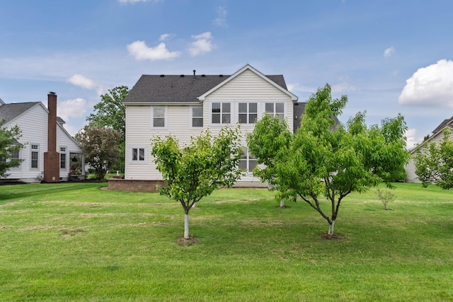 3899 Hampshire Ave, Powell, OH 43065 - rear view of house featuring a yard and a shingled roof