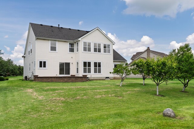3899 Hampshire Ave, Powell, OH 43065 - back of house with a shingled roof, a yard, and cooling unit