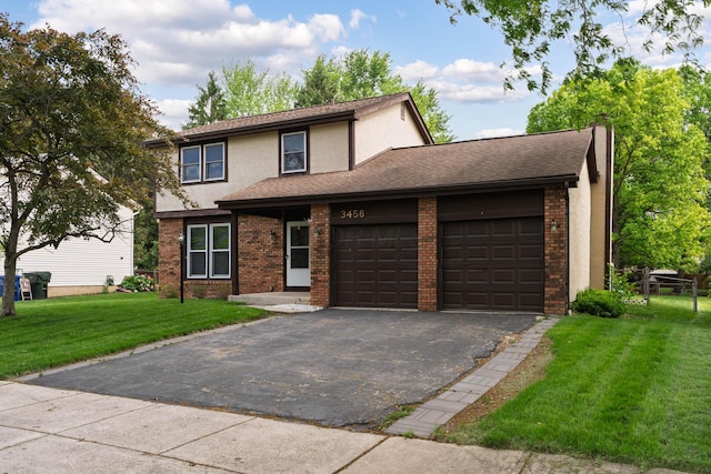 3456 Merrydawn Dr, Columbus, OH 43221 - view of front facade featuring driveway, a garage, a front yard, stucco siding, and brick siding