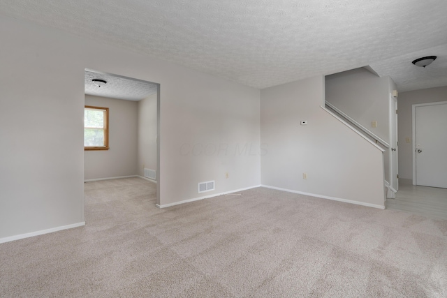 3456 Merrydawn Dr, Columbus, OH 43221 - carpeted spare room featuring a textured ceiling and baseboards