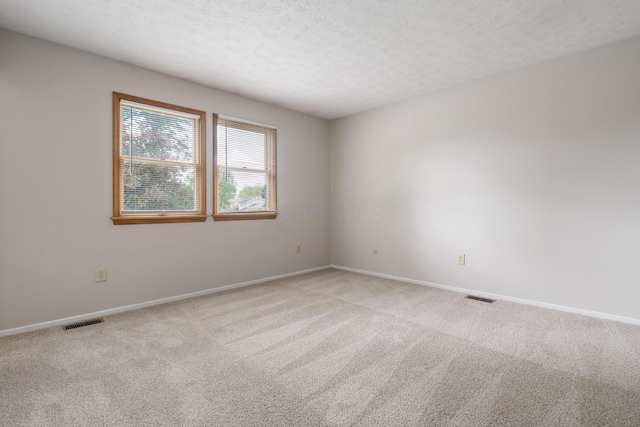 3456 Merrydawn Dr, Columbus, OH 43221 - carpeted empty room with baseboards and a textured ceiling