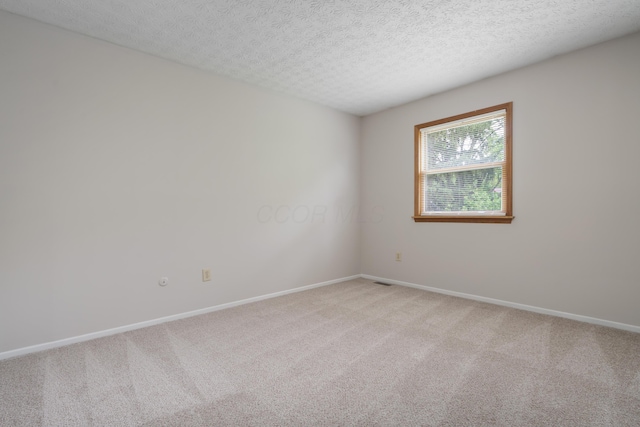 3456 Merrydawn Dr, Columbus, OH 43221 - empty room featuring light colored carpet, baseboards, and a textured ceiling