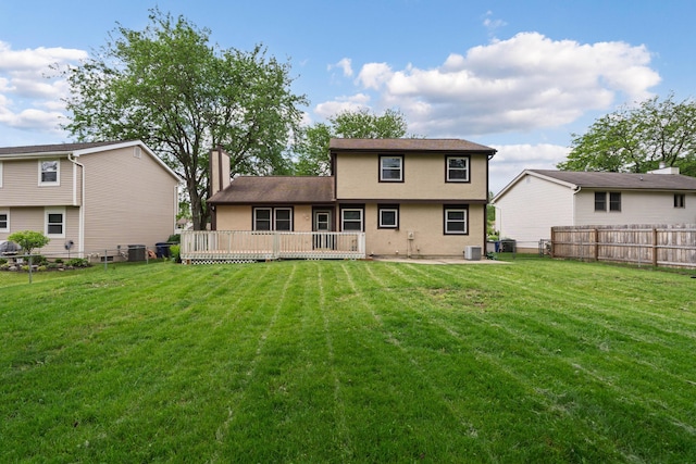 3456 Merrydawn Dr, Columbus, OH 43221 - back of house with stucco siding, a chimney, cooling unit, and a wooden deck